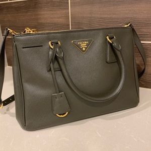 Prada saffiano shoulder bag with top handles.